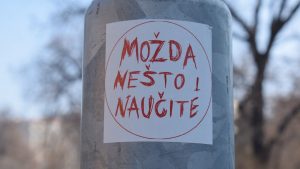 A close up of a sticker on a pole